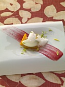 Celery sorbet with pear brandy granita, frozen mango and fruit compote on plate