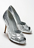 Sliver peep toes on white background
