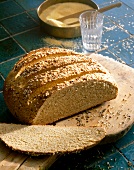 Close-up of bread with anise and sesame seeds on wooden platter