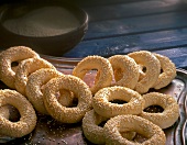 Close-up of sesame rings on wooden tray