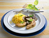 Duck foie gras with saffron risotto and truffles on plate