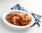 Hungarian paprika chicken on white plate