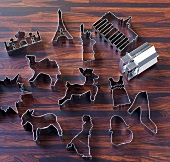 Different types of cookie cutters on wood