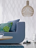 Blue sofas with colourful pillows and lamp
