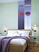 Rattan bed with purple blanket against two wallpaper with flowers on wall