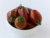 Black plum tomatoes in bowl