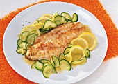 Redfish fillet with lemon zucchini on plate