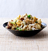 Fried egg rice with mushrooms and spring onion in bowl