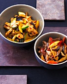 Chicken with cucumber and beef with sweet corn and peppers in bowls