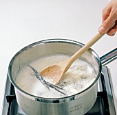 Milk with vanilla beans in saucepan, step 1