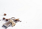 Ginger, cinnamon sticks, star anise and grater on white background 