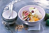 Close-up of fruit salad with melon, fig, orange and lime