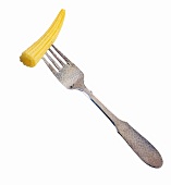Baby corn cob skewered on fork