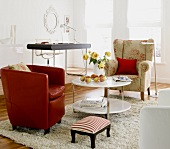 Living room with floral armchair, coffee table and footstool