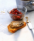 Crostini with spicy mushroom and tomato cubes in bowl
