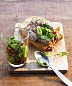 Crostini with tuna and herb salad in glass