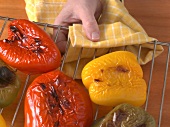Peppers being taken out of oven, step 1