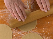 Dough being rolled put into circles for preparation of chapatti, step 1