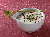 Mint kefir dressing with mint twig in serving bowl