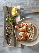 Turkish onion mackerel, shrimps with pepper grains on plate