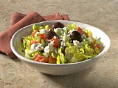 Turkish shepherd salad with olives, tomato and feta cheese in bowl