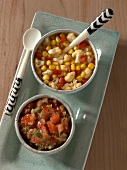 Raw tomato salsa and corn relish with cauliflower and peppers in bowls