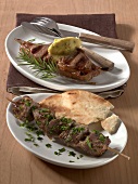 Two plates with grilled and spiced lamb chops and Indian lamb kebab