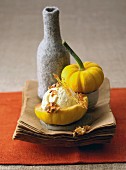 Vanilla ice cream with caramel lattice and walnuts served in hollowed-out pumpkin