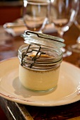 Close -up of creme caramel jar on plate