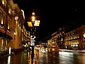View of illuminated houses and road at night in Nevsky Prospekt, St. Petersburg, Russia