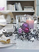 Wind light from glass with pillar candle and Christmas tree decorations