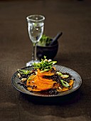 Warm lentil salad with sweet potatoes, leek and pine nuts