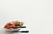 Pork shoulder with pepper and herb on white background