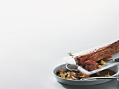 Vegetables in serving dish and meat on cutting board, copy space