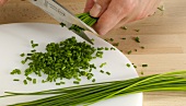 Chives being cut with scissors, step 3