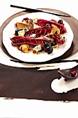 Salad with blue cheese, mushrooms, grapes and cranberries on plate