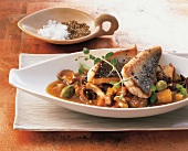 Pot-au-feu of gurnard with star anise in serving plate