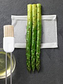 Place asparagus on tissue paper, step 1