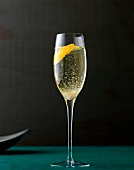 Classic champagne cocktail with lemon zest tingles