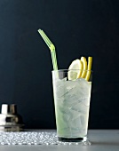 Glass of gin fizz classic with three slices of lemon on ice