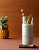 Pina Colada classic with coconut milk, rum and pineapple leaf