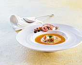 Gazpacho with anchovies and croutons on plate