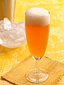 Aperol with fruit juice in champagne glass