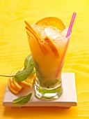 Mississippi melody with orange, mint and ice cubes in glass