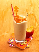 Nektander smoothies with orange peel in highball glass