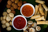 Pancake rolls and dips at Dhigufinolhu Island in Maldives, overhead view