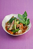 Veal with spring vegetables and Thai basil
