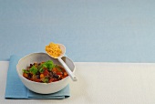 Chilli con carne in bowl with spoon