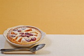 Apricot and cherry clafoutis in serving dish