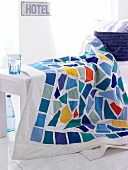 Blanket with blue and white mosaic pattern